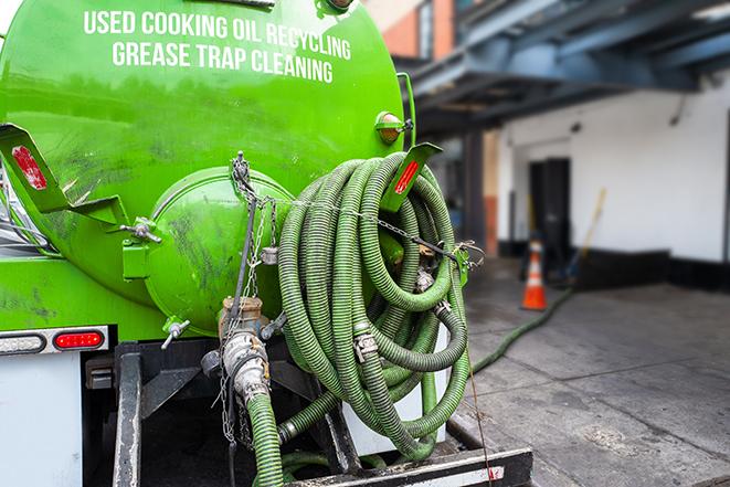 pumping out a heavy-duty grease trap at a restaurant in Albany, CA